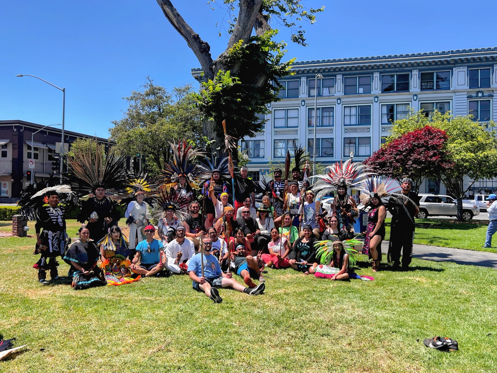 Kalpulli Ehecacoatl members gather in full regalia at a community event