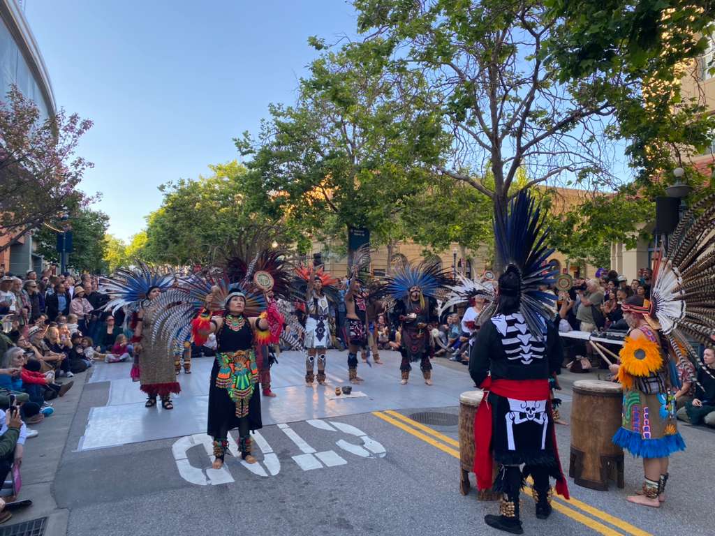 Dancers perform in the street for a seated crowd during Santa Cruz Dance Week